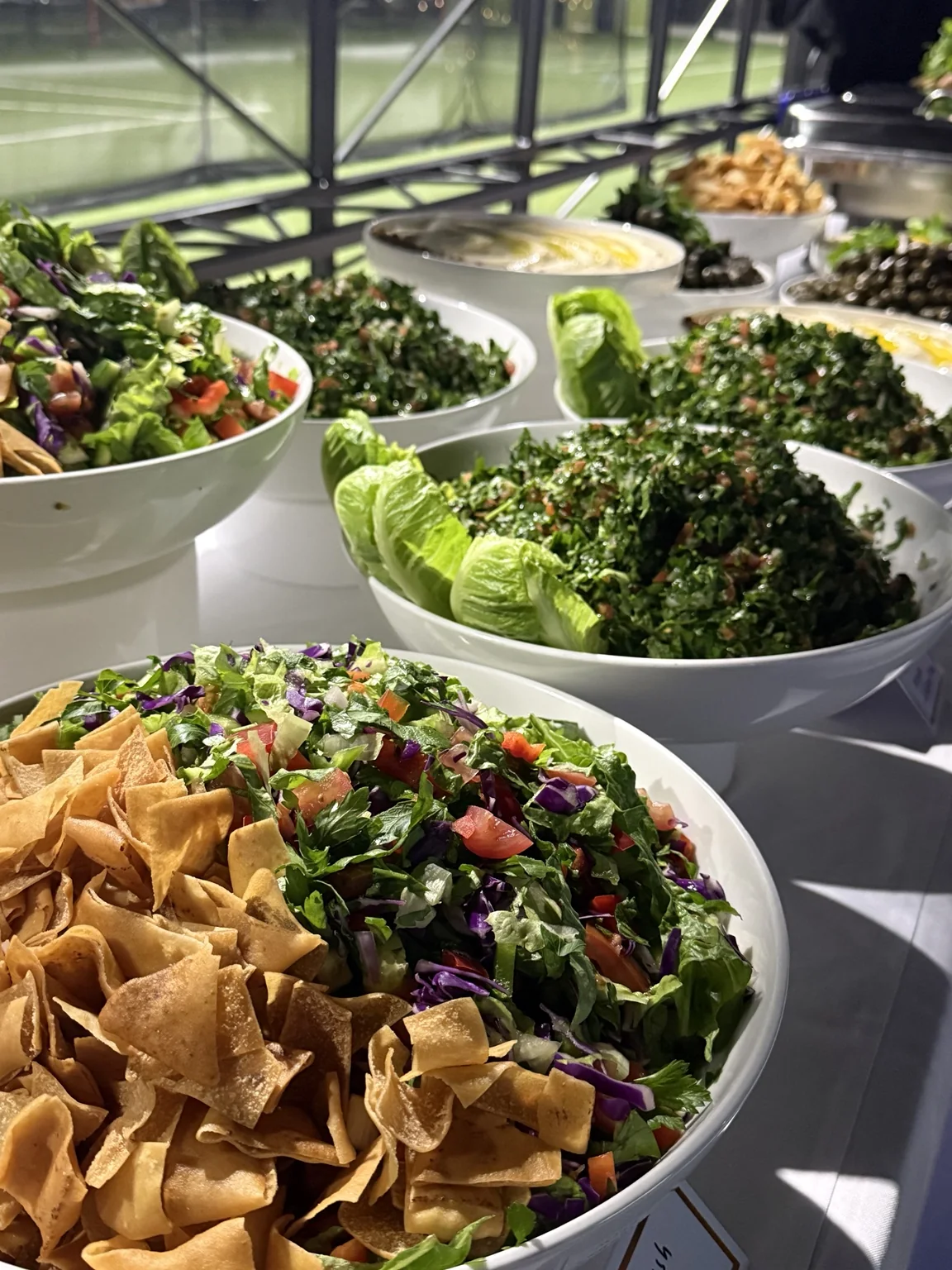 Salads and shared dishes arranged for a gathering